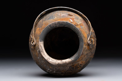 A rare Chinese parcel-gilt silver handled jar with floral scroll design, Tang