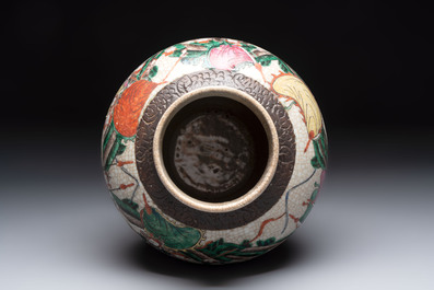 Two Chinese Nanking famille verte covered vases and a famille rose vase, 19th C.
