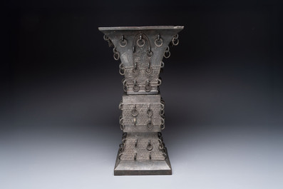 A large Chinese bronze quadrangular 'gu' vase with hanging rings, Ming