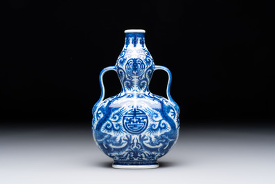 A rare and fine Chinese blue and white double gourd 'dragon' vase with ruyi handles, Qianlong mark and of the period