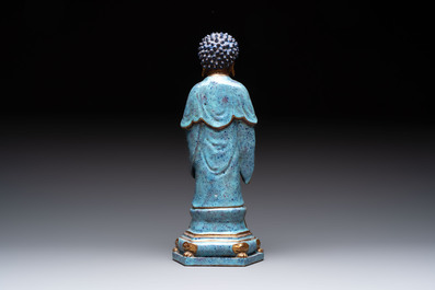 A Chinese robin's egg-glazed gilt-decorated standing Buddha, 18th C.