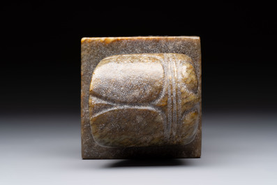A pair of Chinese carved stone Buddhist lions, a large seal and a wooden box with four seals, 20th C.