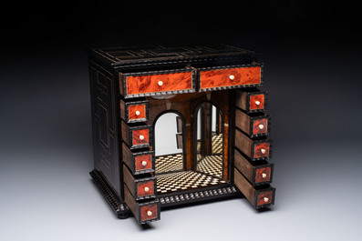 A small tortoiseshell-veneered cabinet of drawers with mirrored interior, Antwerp, 17th C.