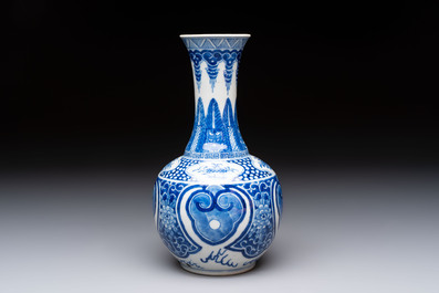 A Chinese blue and white vase with floral design, 19th C.
