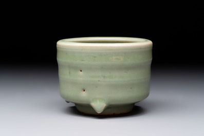 A small Chinese Longquan celadon cylindrical tripod censer, Ming