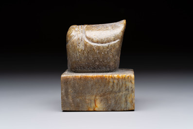 A pair of Chinese carved stone Buddhist lions, a large seal and a wooden box with four seals, 20th C.
