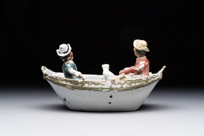 A cold-painted white Dutch Delft 'rowing boat' group, 18th C.