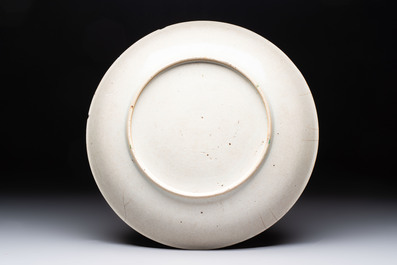 Three Chinese famille rose dishes, two plates and a saucer, various marks, 19th C.