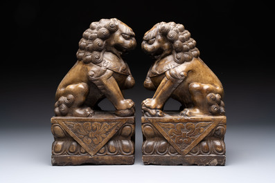 A pair of Chinese carved stone Buddhist lions, a large seal and a wooden box with four seals, 20th C.