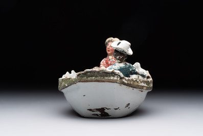 A cold-painted white Dutch Delft 'rowing boat' group, 18th C.