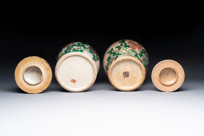Two Chinese Nanking famille verte covered vases and a famille rose vase, 19th C.