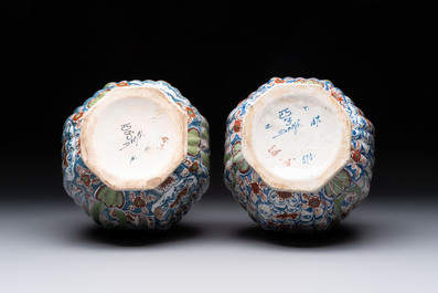 A pair of polychrome Dutch Delft double gourd vases, 19th C.