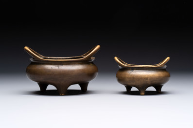Two Chinese bronze tripod censers, Xuande marks, 19th C.