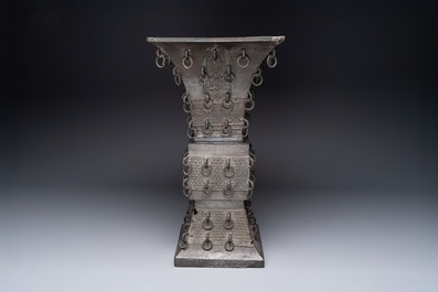 A large Chinese bronze quadrangular 'gu' vase with hanging rings, Ming