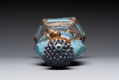 A Chinese robin's egg-glazed gilt-decorated standing Buddha, 18th C.