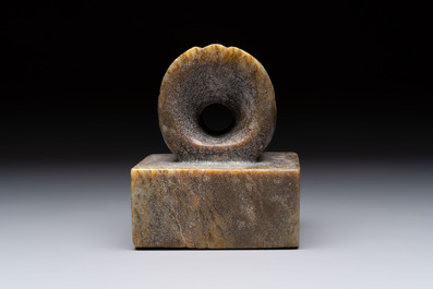 A pair of Chinese carved stone Buddhist lions, a large seal and a wooden box with four seals, 20th C.