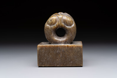 A pair of Chinese carved stone Buddhist lions, a large seal and a wooden box with four seals, 20th C.