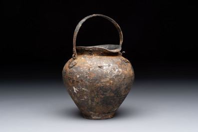 A rare Chinese parcel-gilt silver handled jar with floral scroll design, Tang