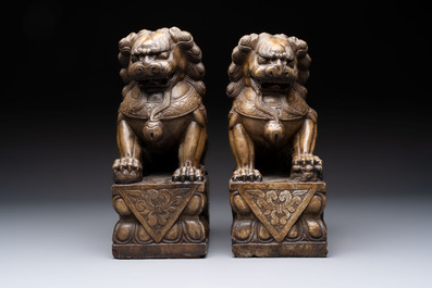 A pair of Chinese carved stone Buddhist lions, a large seal and a wooden box with four seals, 20th C.