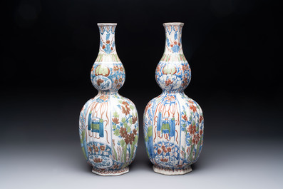 A pair of polychrome Dutch Delft double gourd vases, 19th C.
