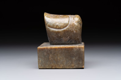 A pair of Chinese carved stone Buddhist lions, a large seal and a wooden box with four seals, 20th C.