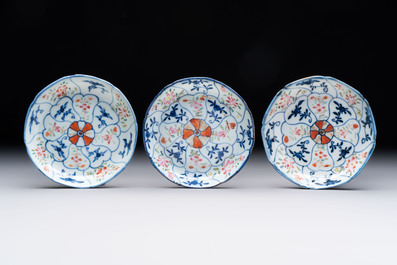 Eleven Chinese famille rose cups and nine saucers, Yongzheng/Qianlong