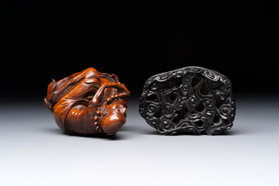 A Chinese fine huanghuali sculpture of a Luohan on a zitan stand, Qianlong mark, 19/20th C.