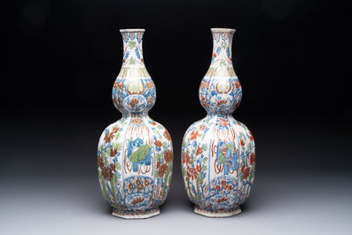 A pair of polychrome Dutch Delft double gourd vases, 19th C.