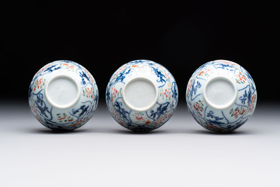 Eleven Chinese famille rose cups and nine saucers, Yongzheng/Qianlong