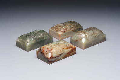 A pair of Chinese carved stone Buddhist lions, a large seal and a wooden box with four seals, 20th C.