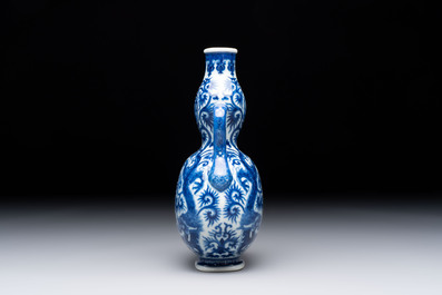 A rare and fine Chinese blue and white double gourd 'dragon' vase with ruyi handles, Qianlong mark and of the period