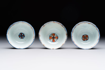 Eleven Chinese famille rose cups and nine saucers, Yongzheng/Qianlong