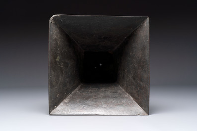 A large Chinese bronze quadrangular 'gu' vase with hanging rings, Ming