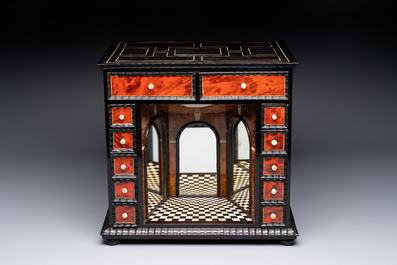 A small tortoiseshell-veneered cabinet of drawers with mirrored interior, Antwerp, 17th C.