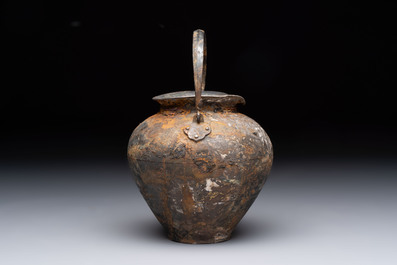 A rare Chinese parcel-gilt silver handled jar with floral scroll design, Tang