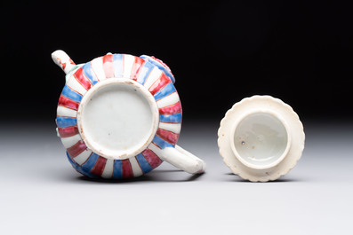 A Chinese famille rose frogspawn-ground relief-molded teapot and cover, Yongzheng