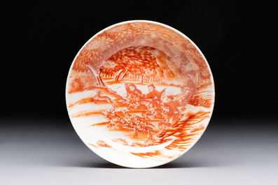 A Chinese iron-red-decorated 'Deer Hunting' cup and saucer, Qianlong