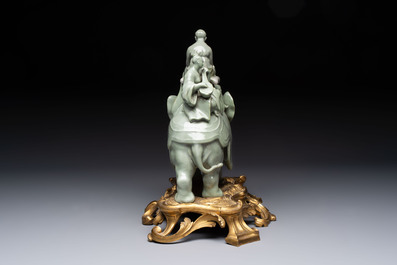 * A gilt-bronze-mounted celadon-glazed group of three figures riding an elephant, probably Samson, Paris, 19th C.