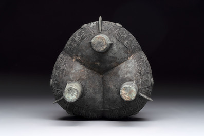 A Chinese archaic bronze tripod food vessel with 'taotie' design, 'ding 鼎', Western Zhou