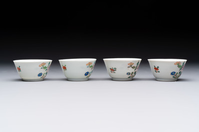 Seven Chinese famille rose cups and eleven saucers with floral design, Qianlong