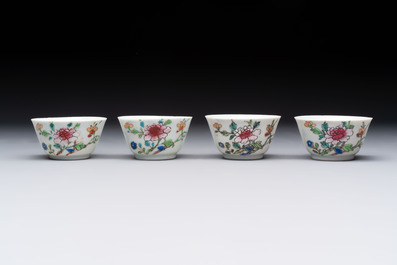 Seven Chinese famille rose cups and eleven saucers with floral design, Qianlong