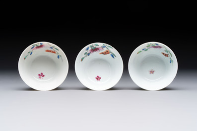 Seven Chinese famille rose cups and eleven saucers with floral design, Qianlong