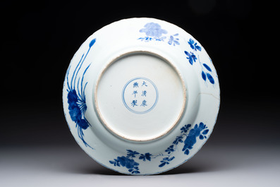 A Chinese blue and white dish with floral design, Kangxi mark and of the period