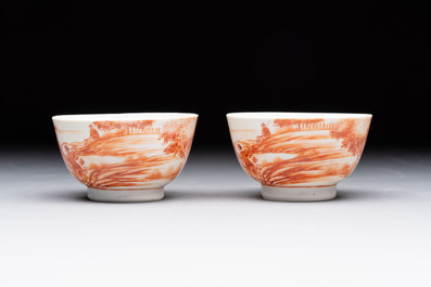 A Chinese iron-red-decorated 'Deer Hunting' bowl and two cups, Qianlong