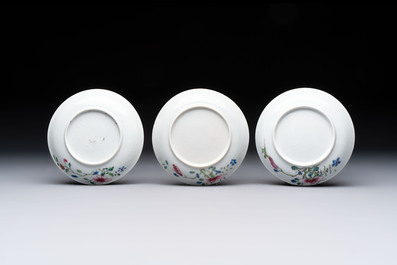 Seven Chinese famille rose cups and eleven saucers with floral design, Qianlong