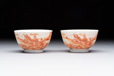 A Chinese iron-red-decorated 'Deer Hunting' bowl and two cups, Qianlong