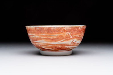 A Chinese iron-red-decorated 'Deer Hunting' bowl and two cups, Qianlong