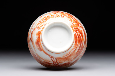 A Chinese iron-red-decorated 'Deer Hunting' cup and saucer, Qianlong