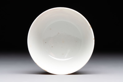 A Chinese iron-red-decorated 'Deer Hunting' cup and saucer, Qianlong