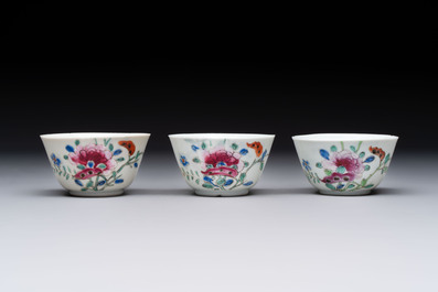 Seven Chinese famille rose cups and eleven saucers with floral design, Qianlong